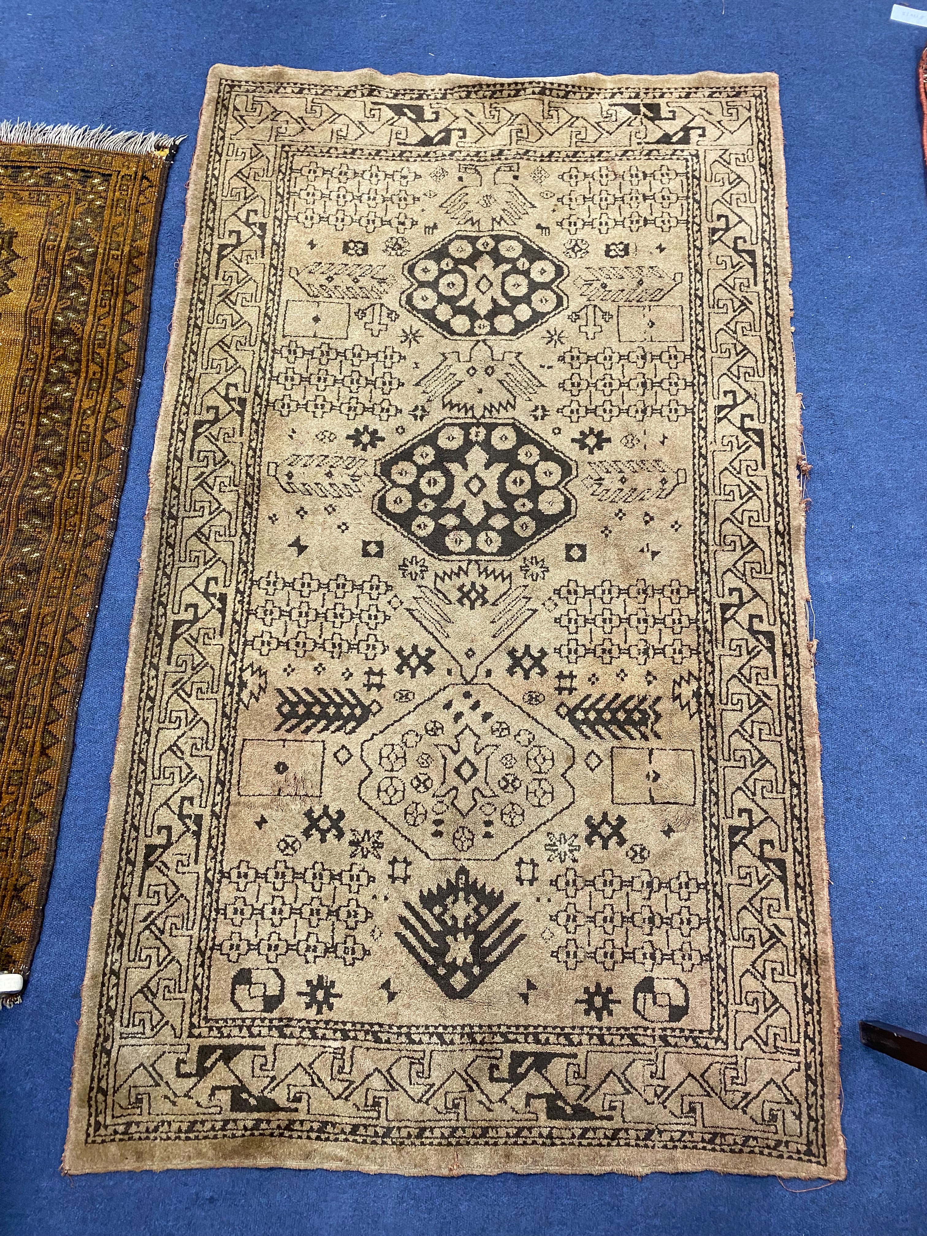 A Bokhara design mustard ground rug, 120 x 103cm together with another rug